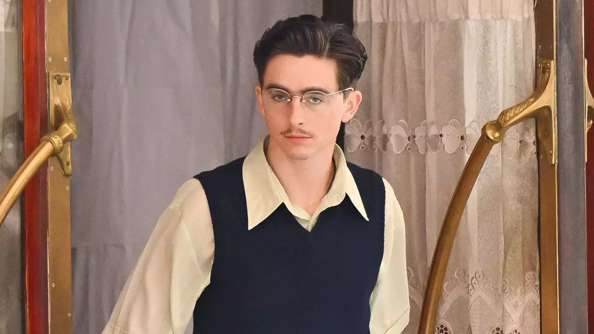 Timoth E Chalamet Rocks Mustache And Glasses On Marty Supreme Set In