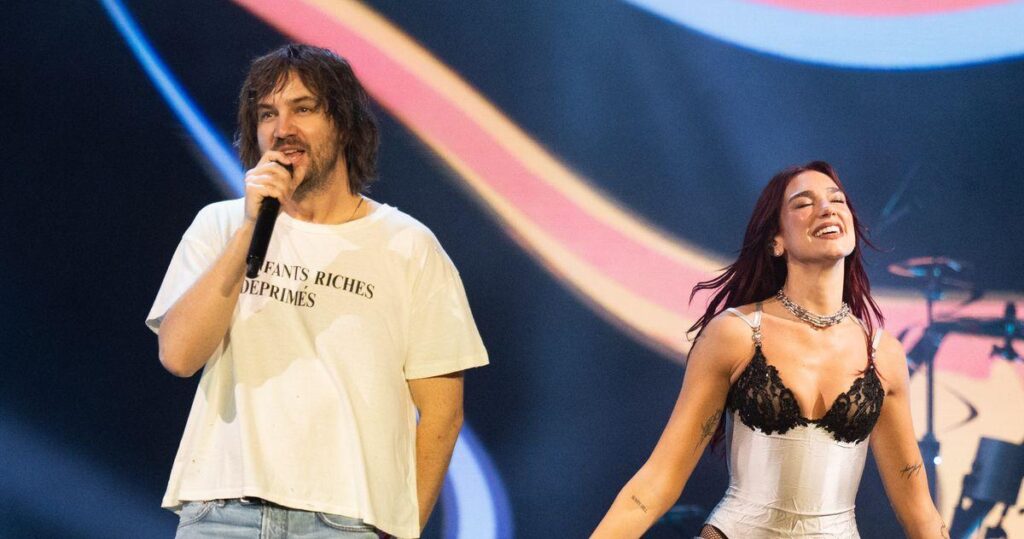 Kevin Parker and Dua Lipa performing on stage