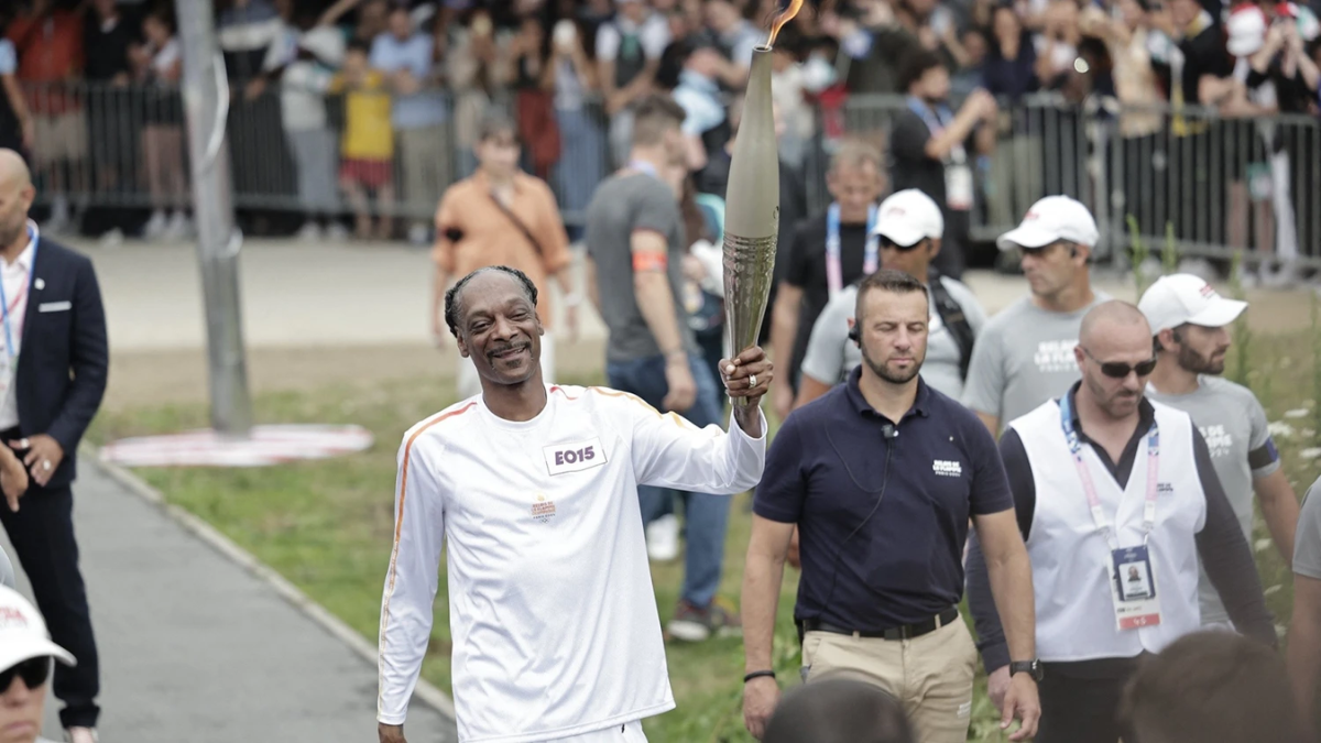 Snoop Dogg Bears the Olympic Torch Through Paris